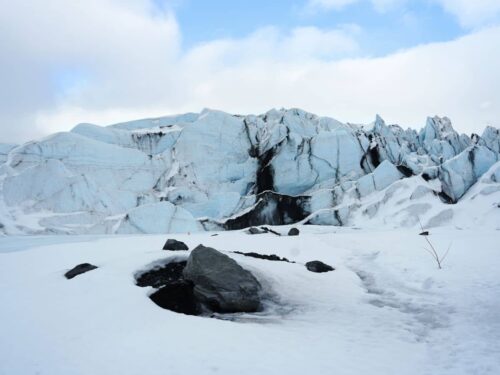 Guests exploring Matanuska Glacier on a guided small group tour with White Raven Tours Alaska